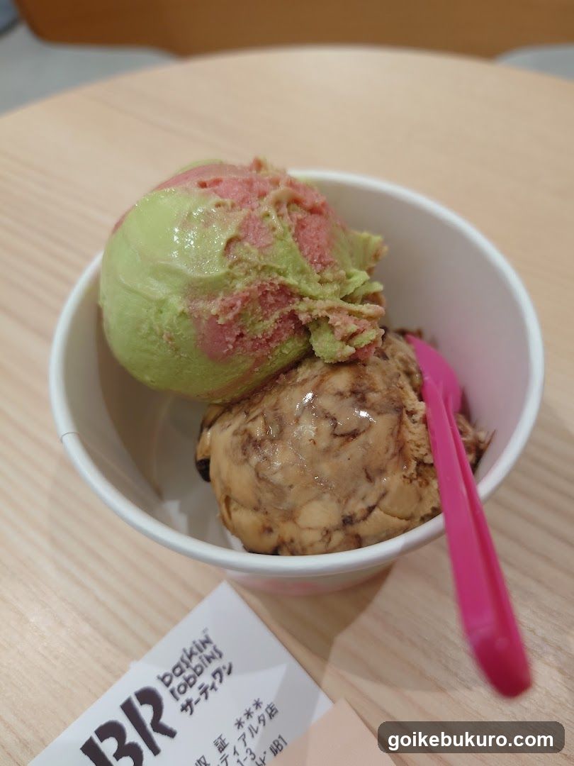Ice cream cup with pink spoon and receipt