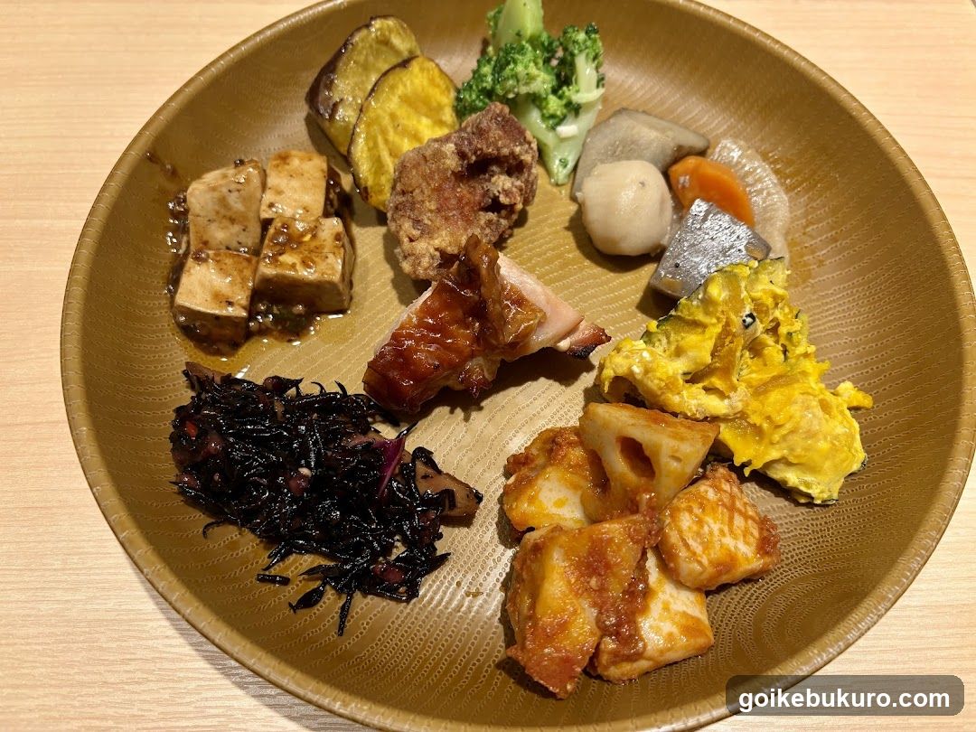 Assorted Japanese-style side dishes on a brown plate