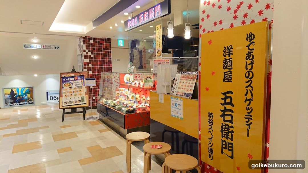 Food stall interior with menu board and display case