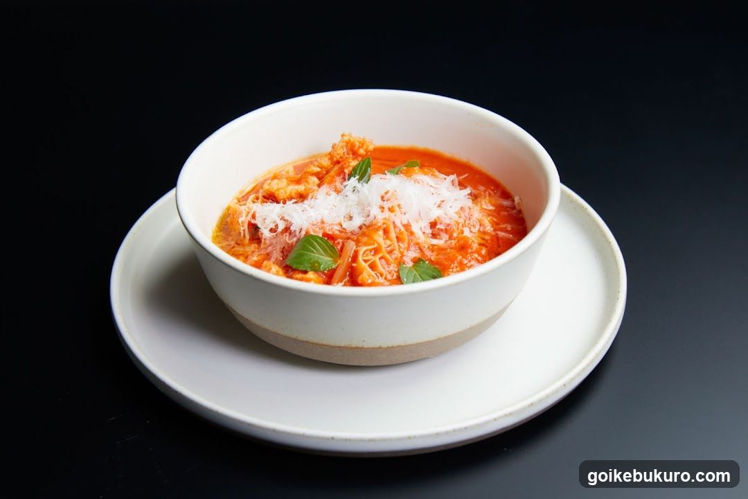Bowl of Tomato Soup with Basil and Cheese