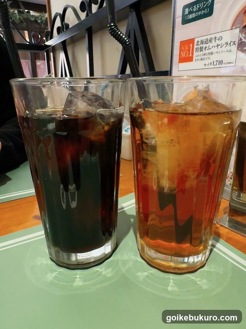 Two glasses of iced drinks in a cafe