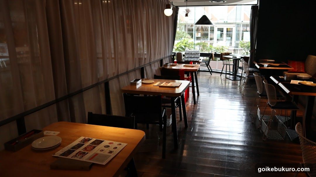 Restaurant Interior with Wooden Tables and Curtains