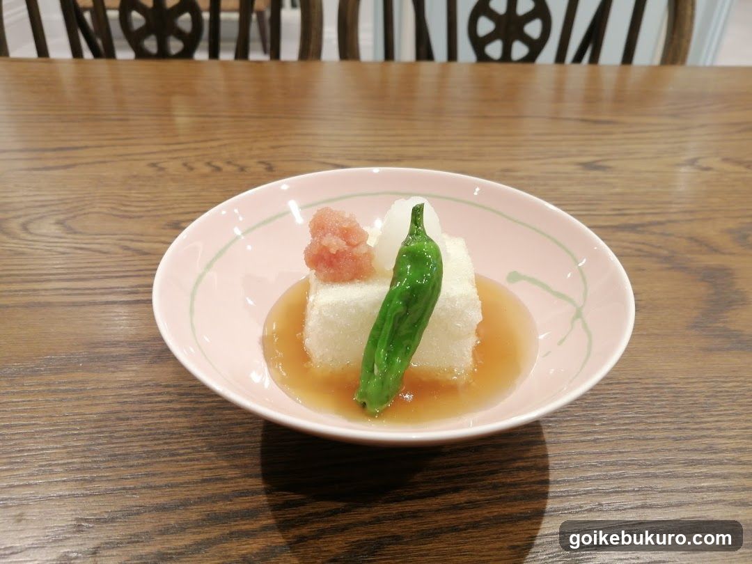Dish with tofu and green chili