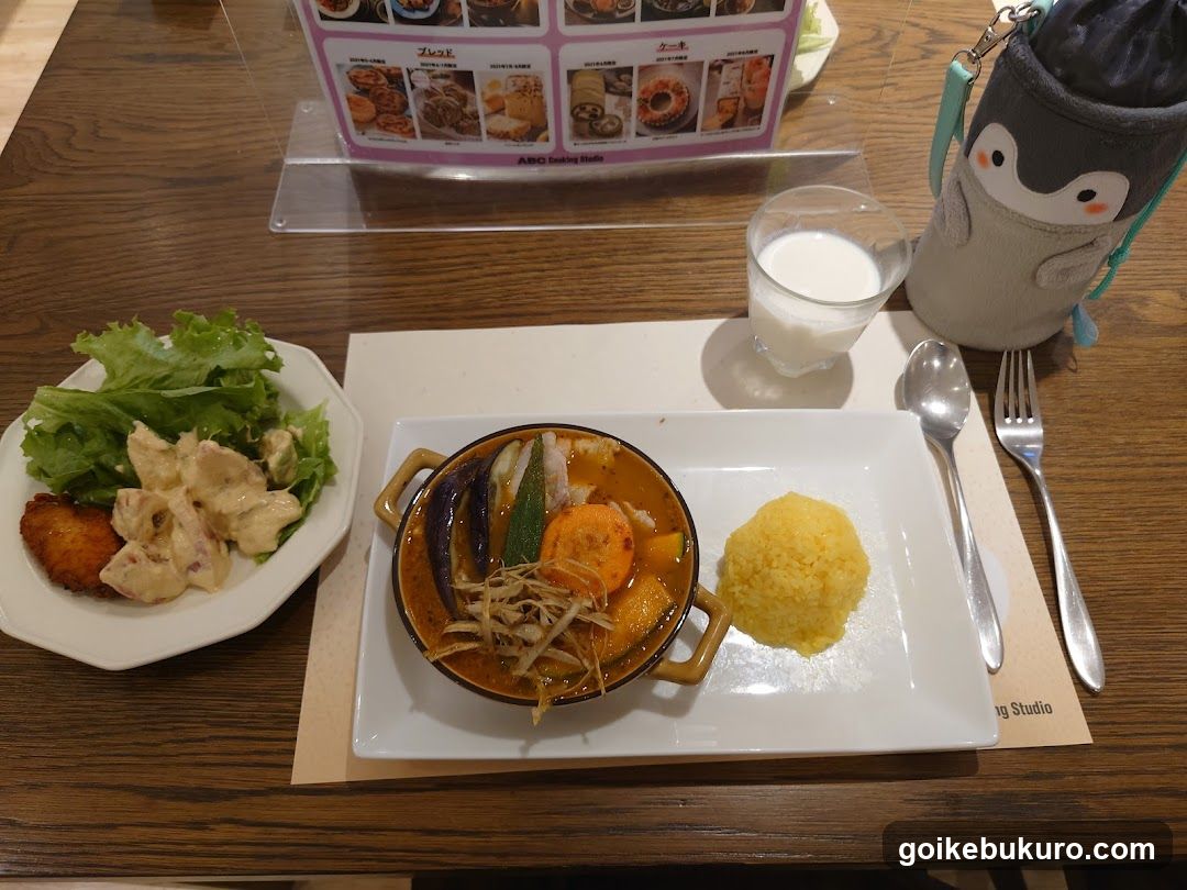 Curry Meal with Salad and Milk