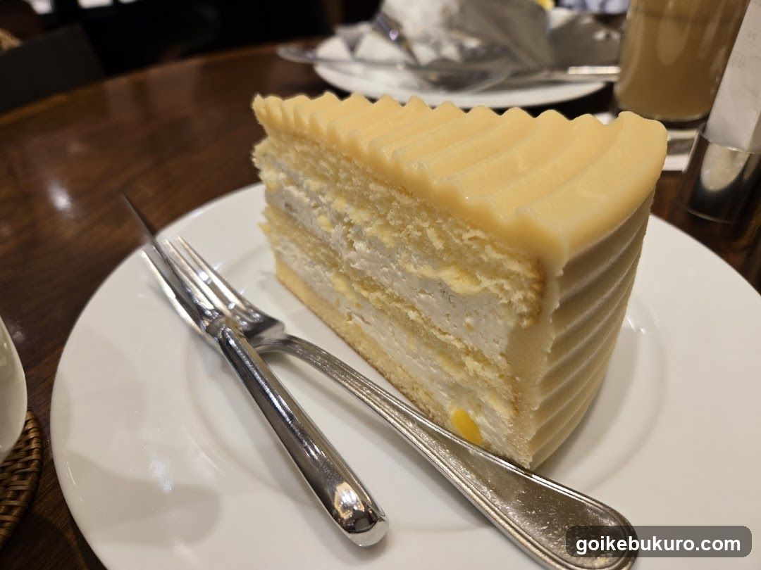 Slice of layered cake on a white plate
