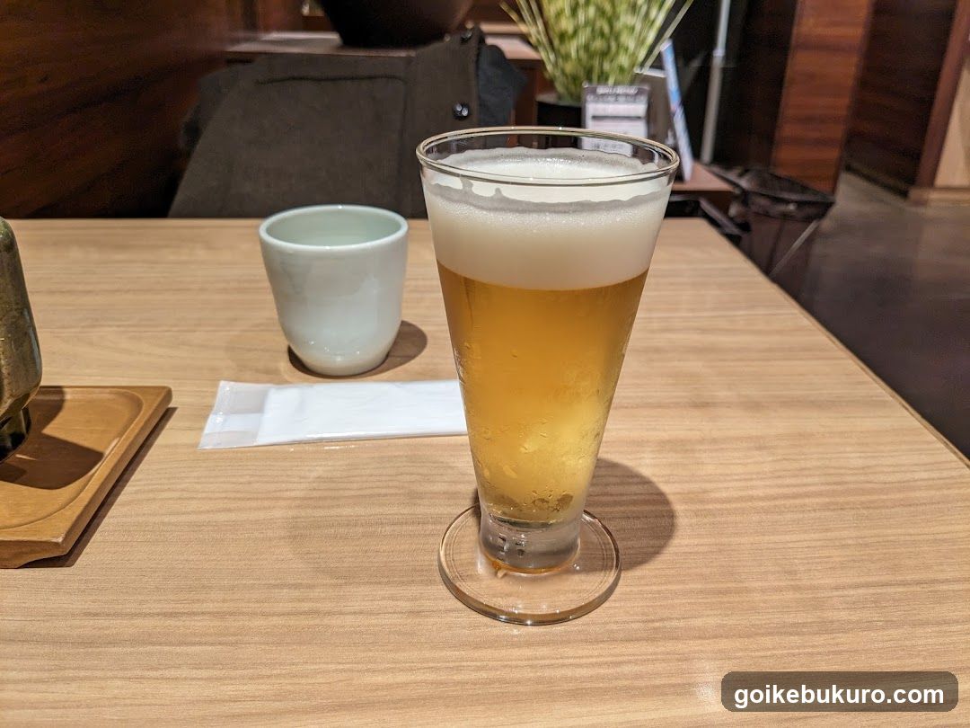 Beer and Cup on Table