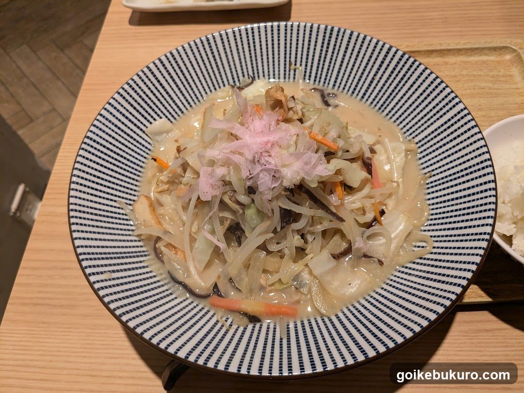 Japanese-style vegetable stew with shredded daikon and pink garnish