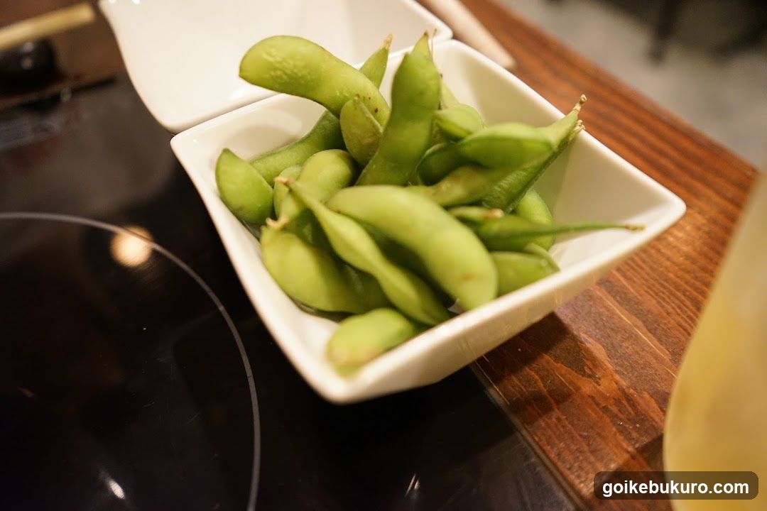 Edamame in a white bowl