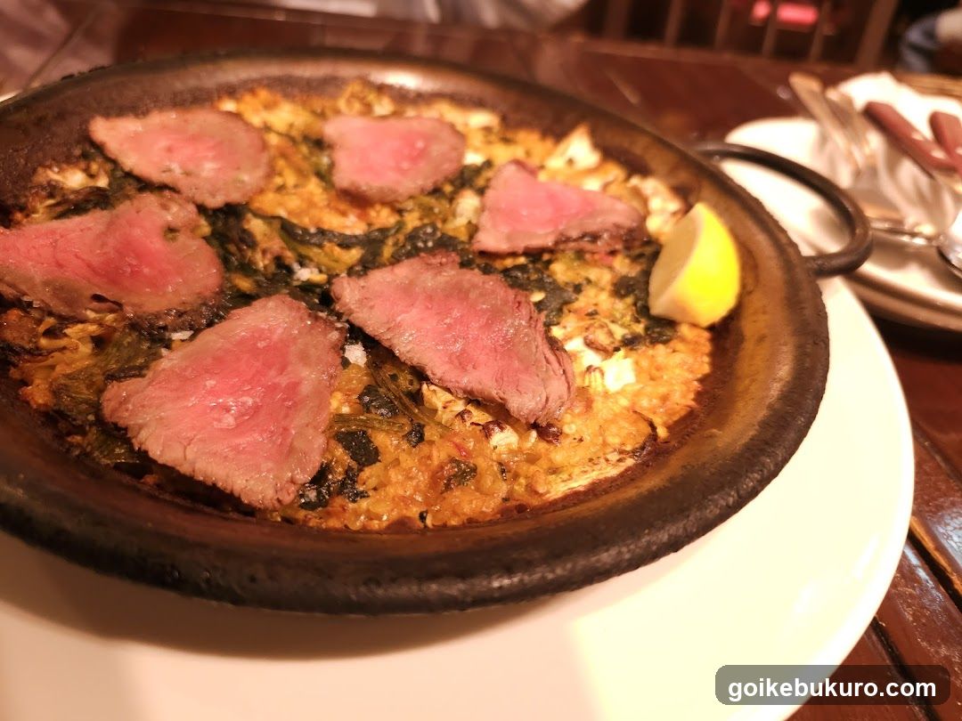 Sizzling Steak Dish with Rice and Greens