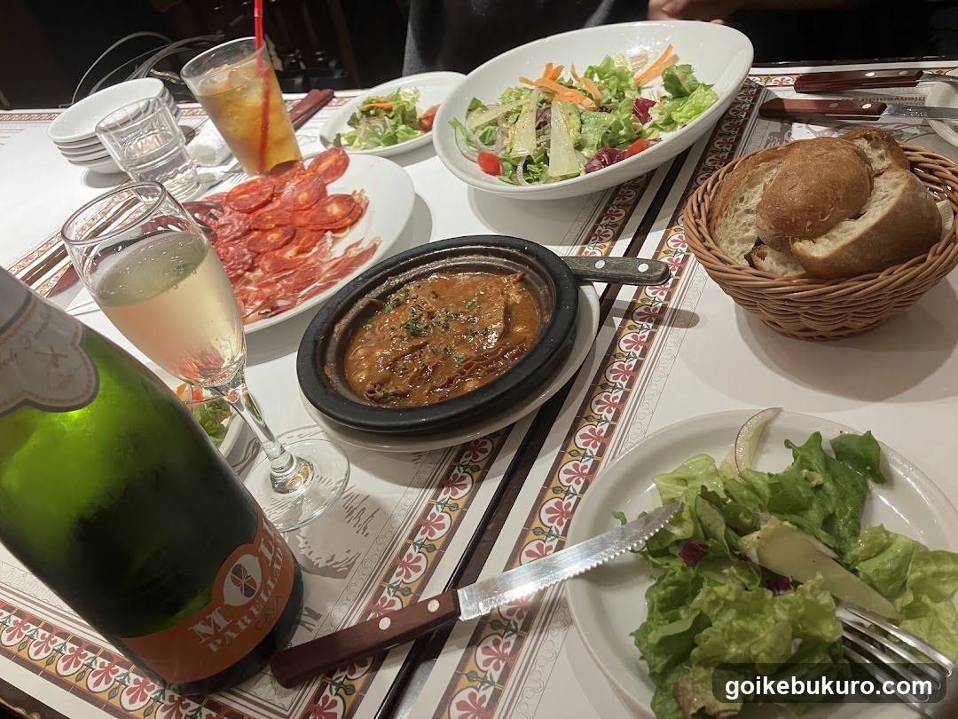 Dinner Table Spread with Salad and Wine