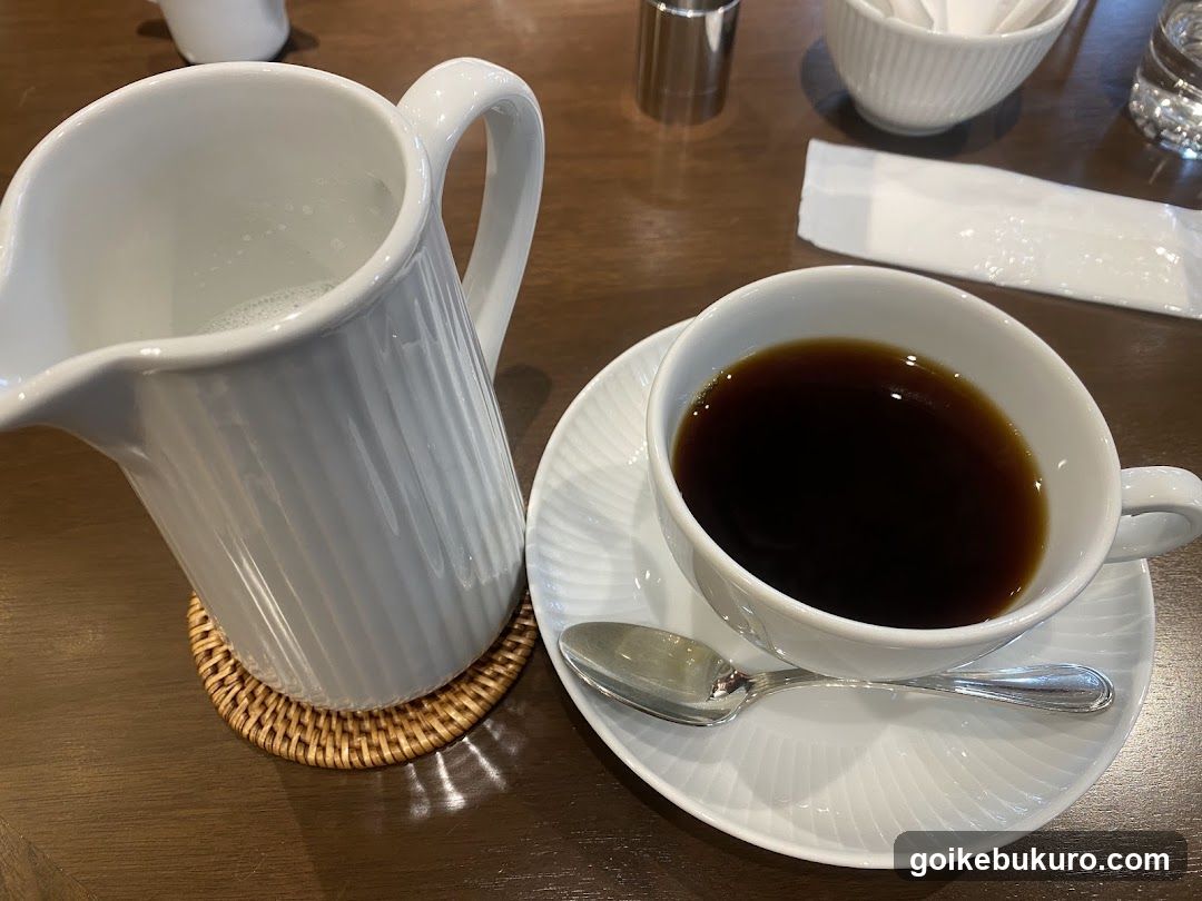 Coffee and Milk Pitcher on Table