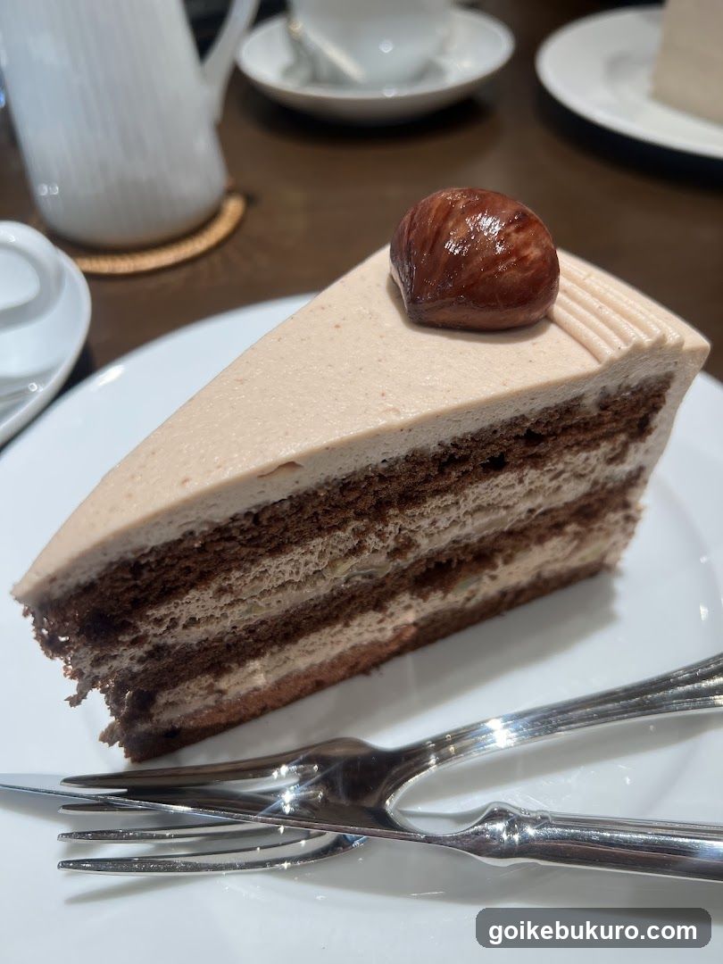 Slice of Layered Cake with Hazelnut Topping