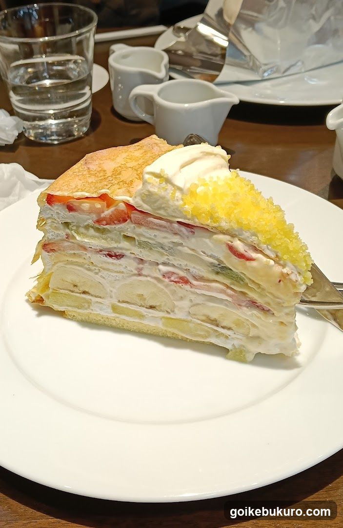 Slice of Layered Cake with Cream and Fruit
