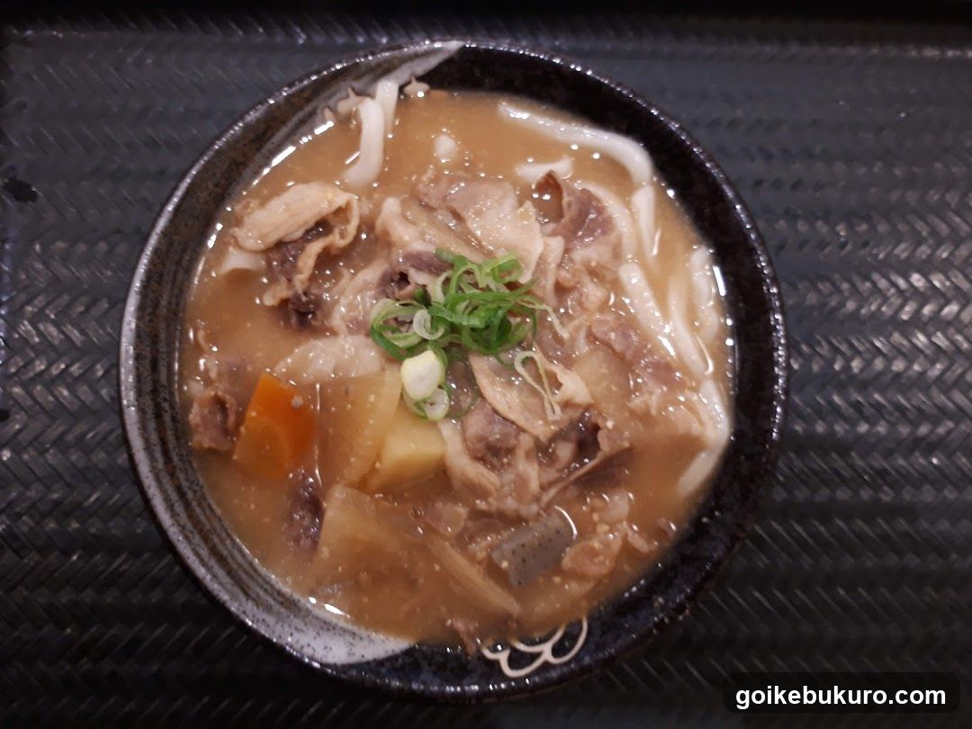Bowl of Noodle Soup with Meat and Vegetables