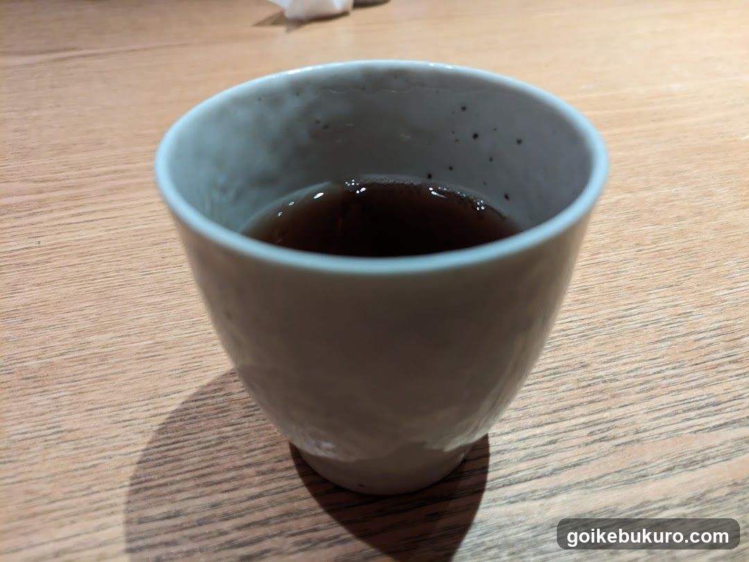 Cup of dark liquid in ceramic mug