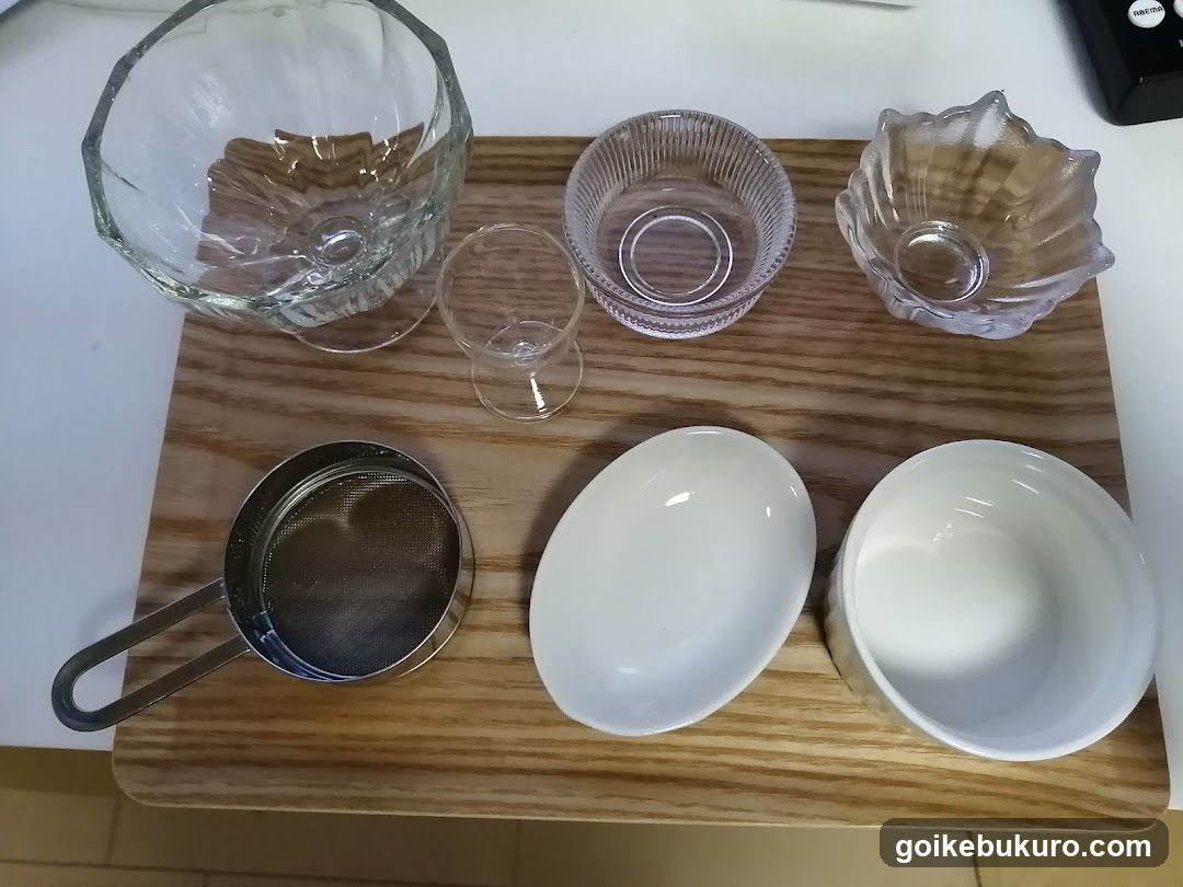 Glassware and Kitchen Tools on Wooden Board