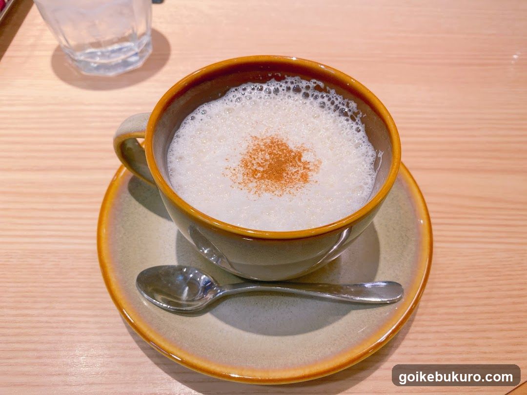Cup of Frothy Drink with Cinnamon Dust