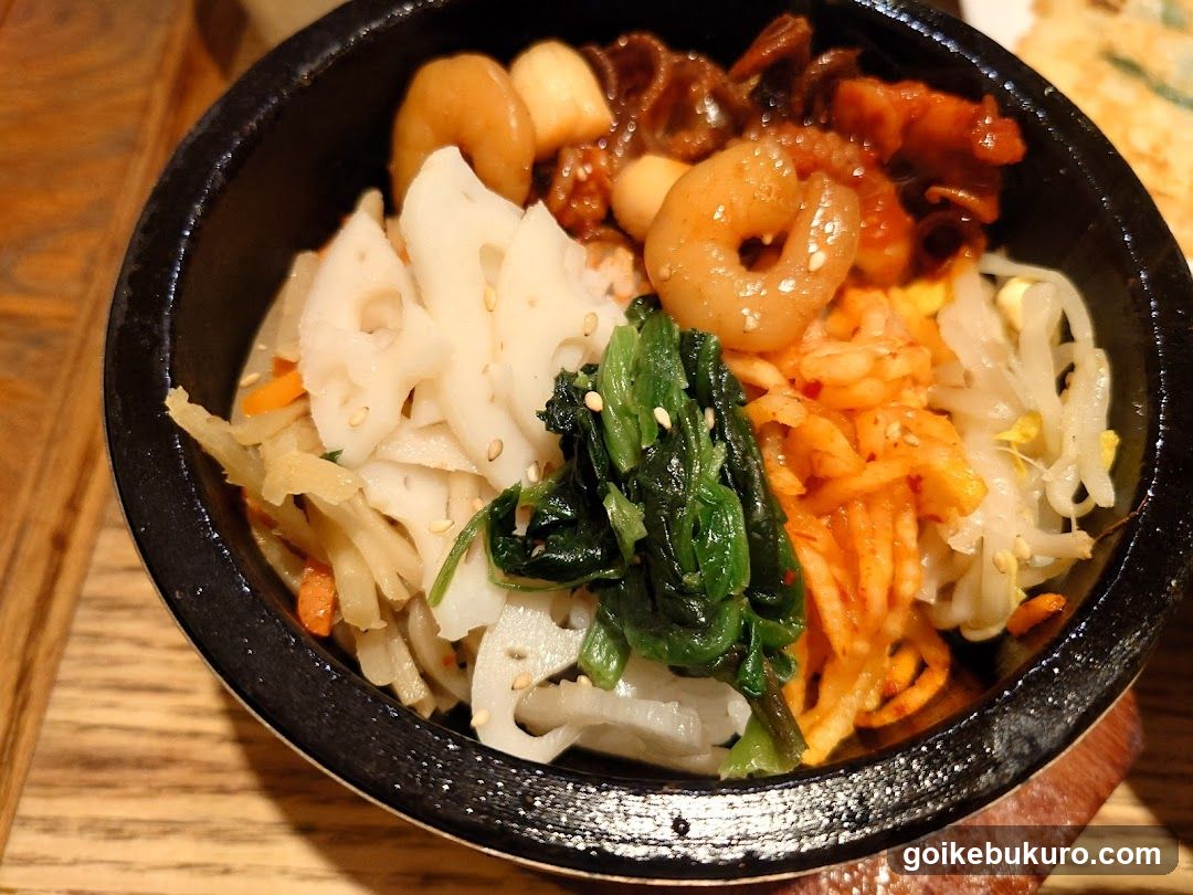 Bowl of Korean-style mixed rice with seafood and vegetables