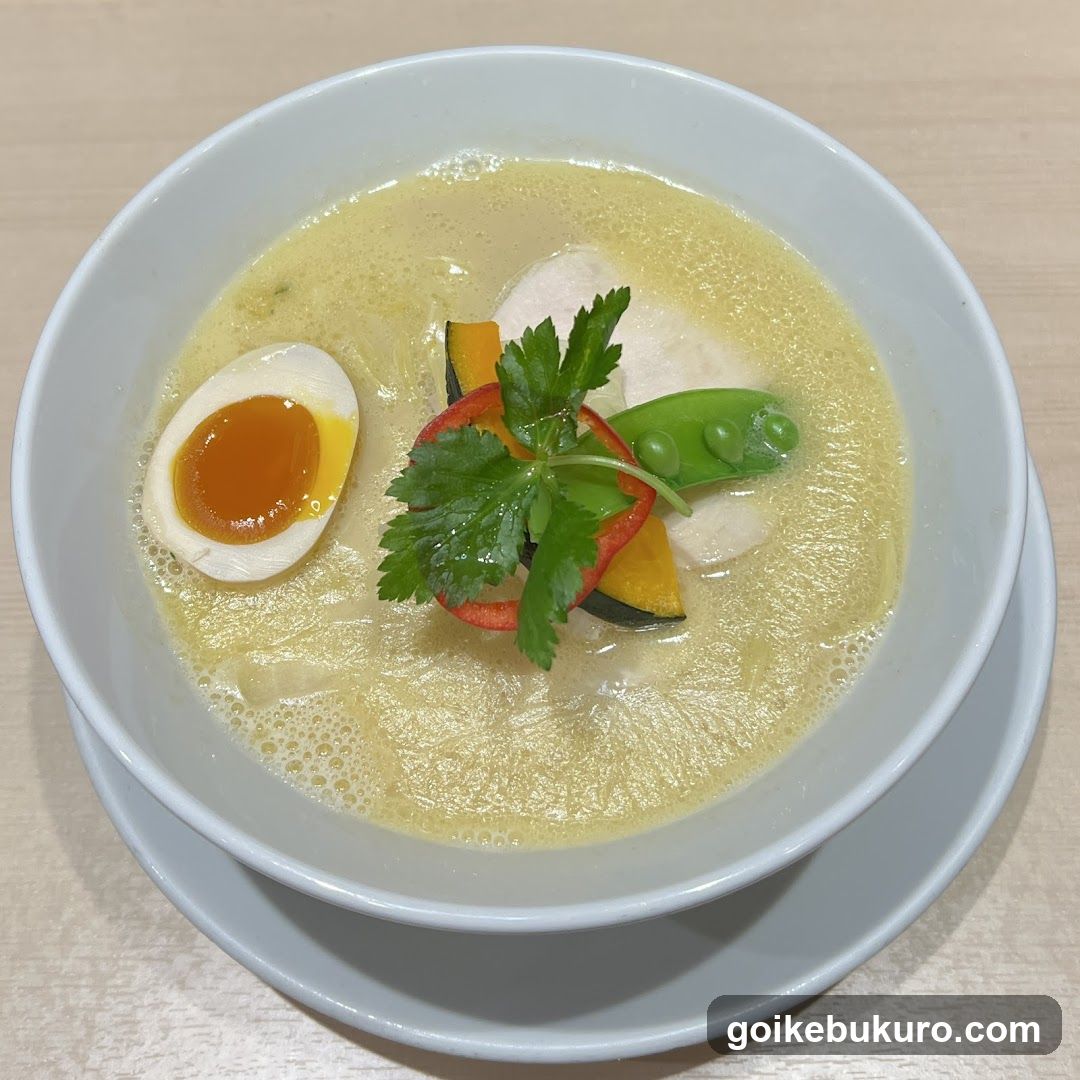 Bowl of creamy soup with egg and vegetables