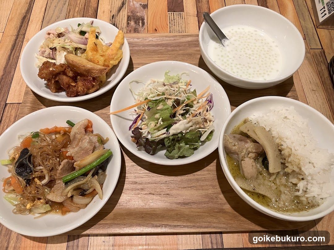 Thai-style meal spread on wooden tray