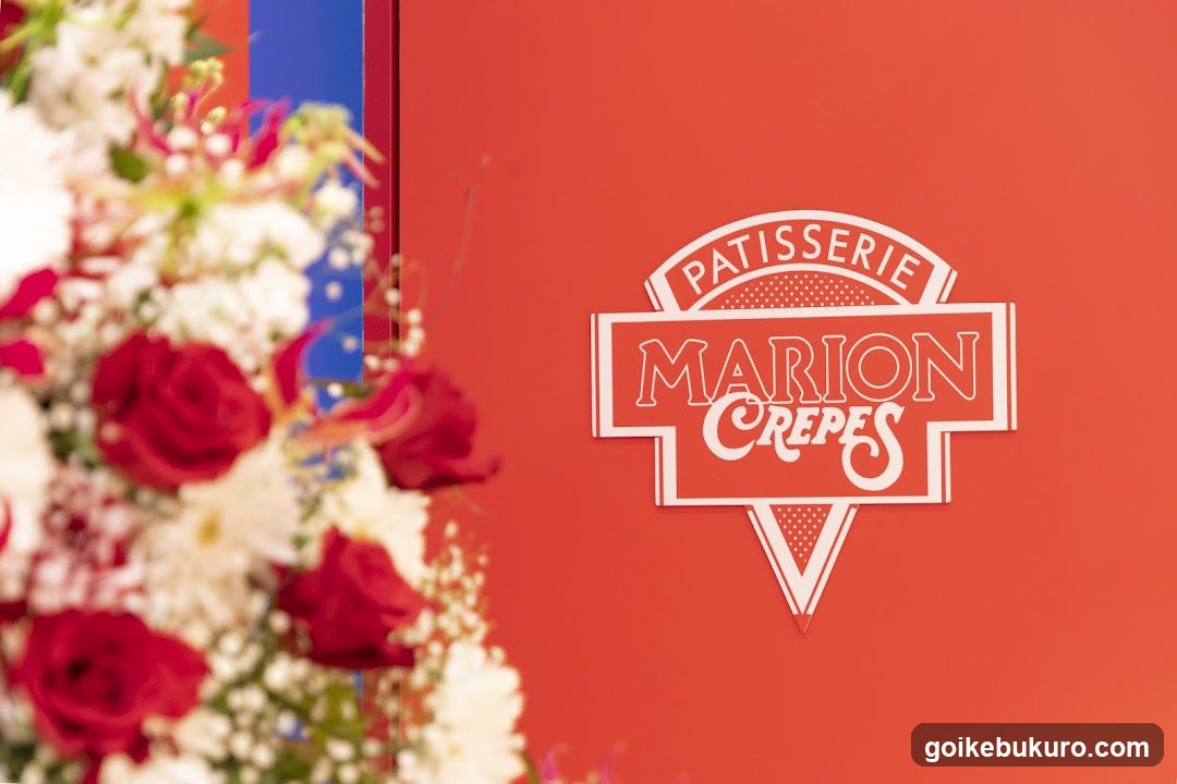 Patisserie Marion Crepes Signage with Floral Arrangement