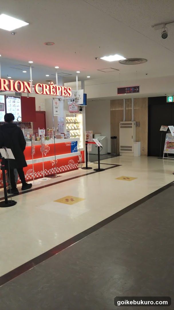 Interior of a shopping mall with crepe stand