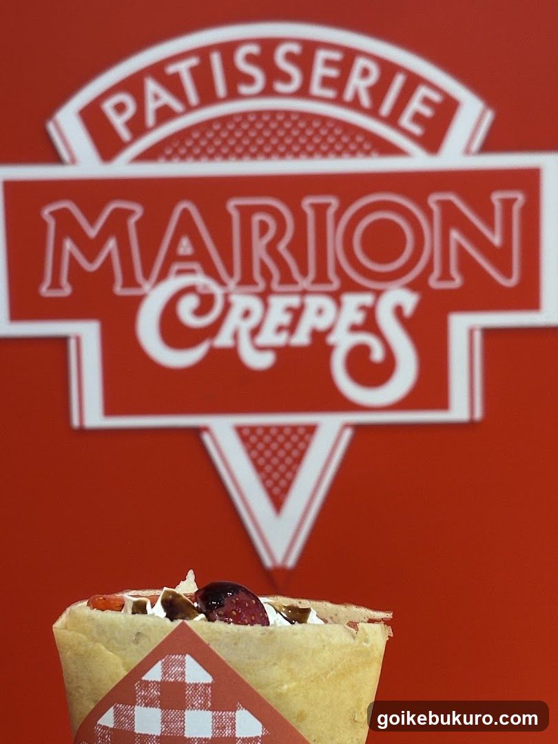 Crepes with toppings in front of a sign