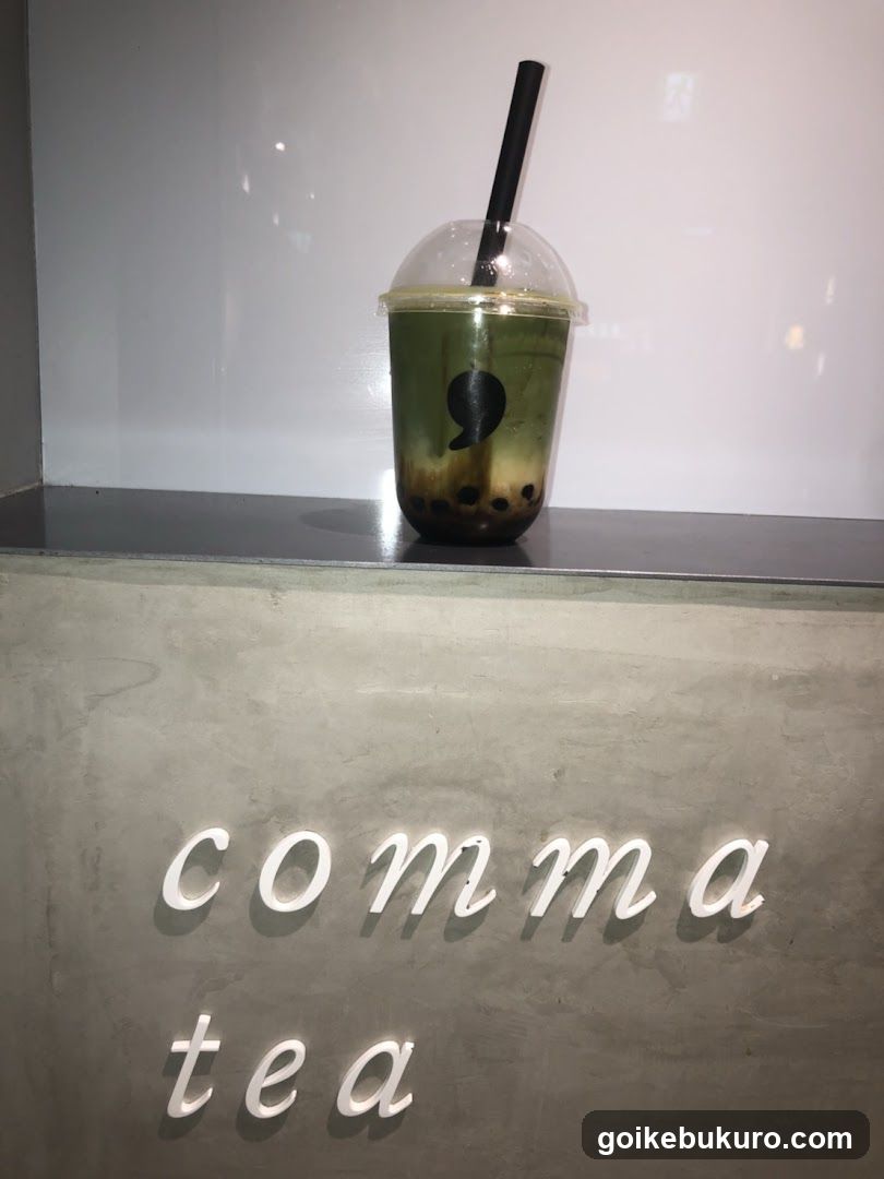 comma tea drink display