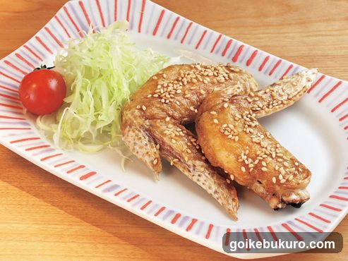 Sesame Chicken Wings with Cabbage and Cherry Tomato