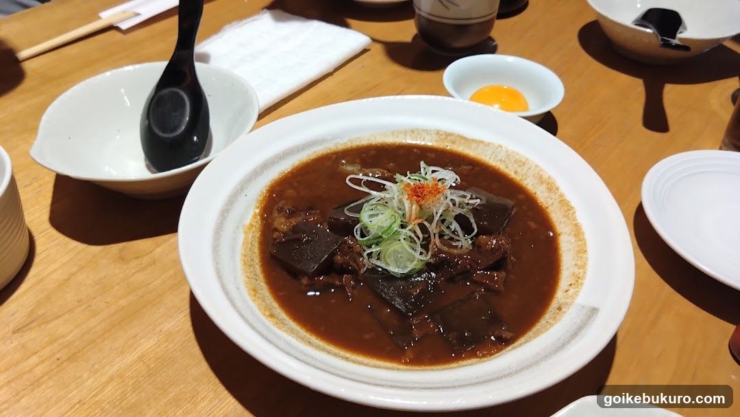 Dish with Dark Sauce and Garnishes