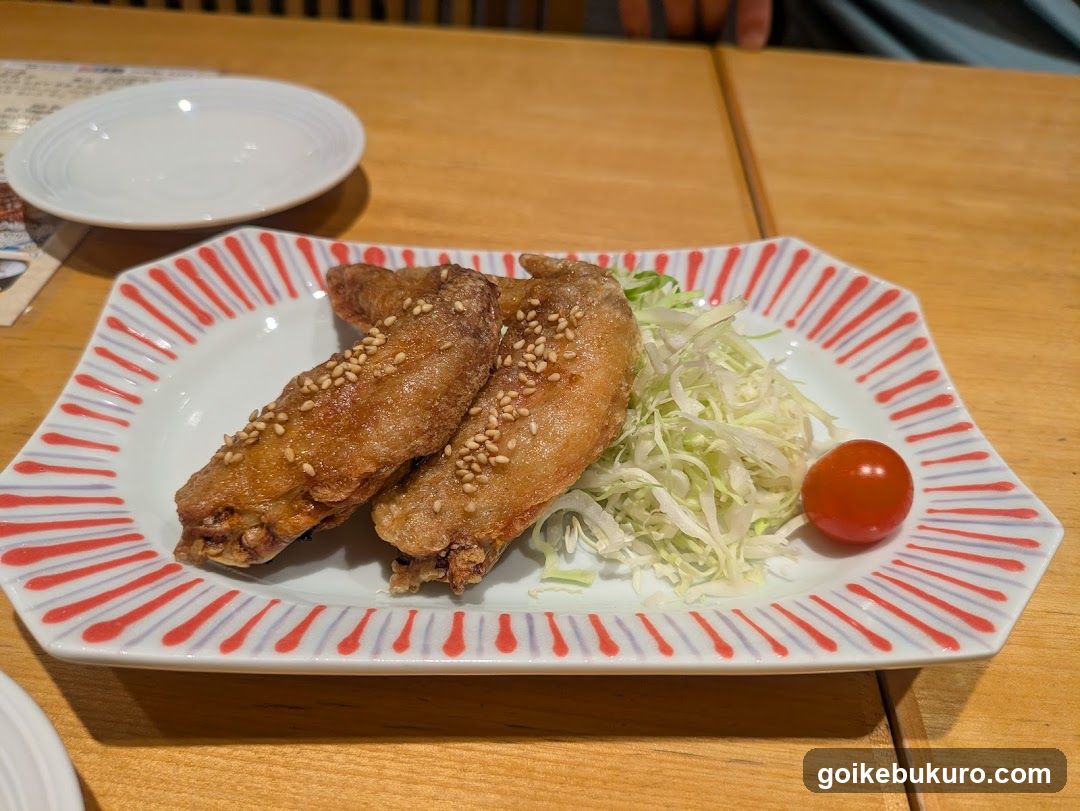 Fried Chicken Wings with Sesame Seeds and Cabbage