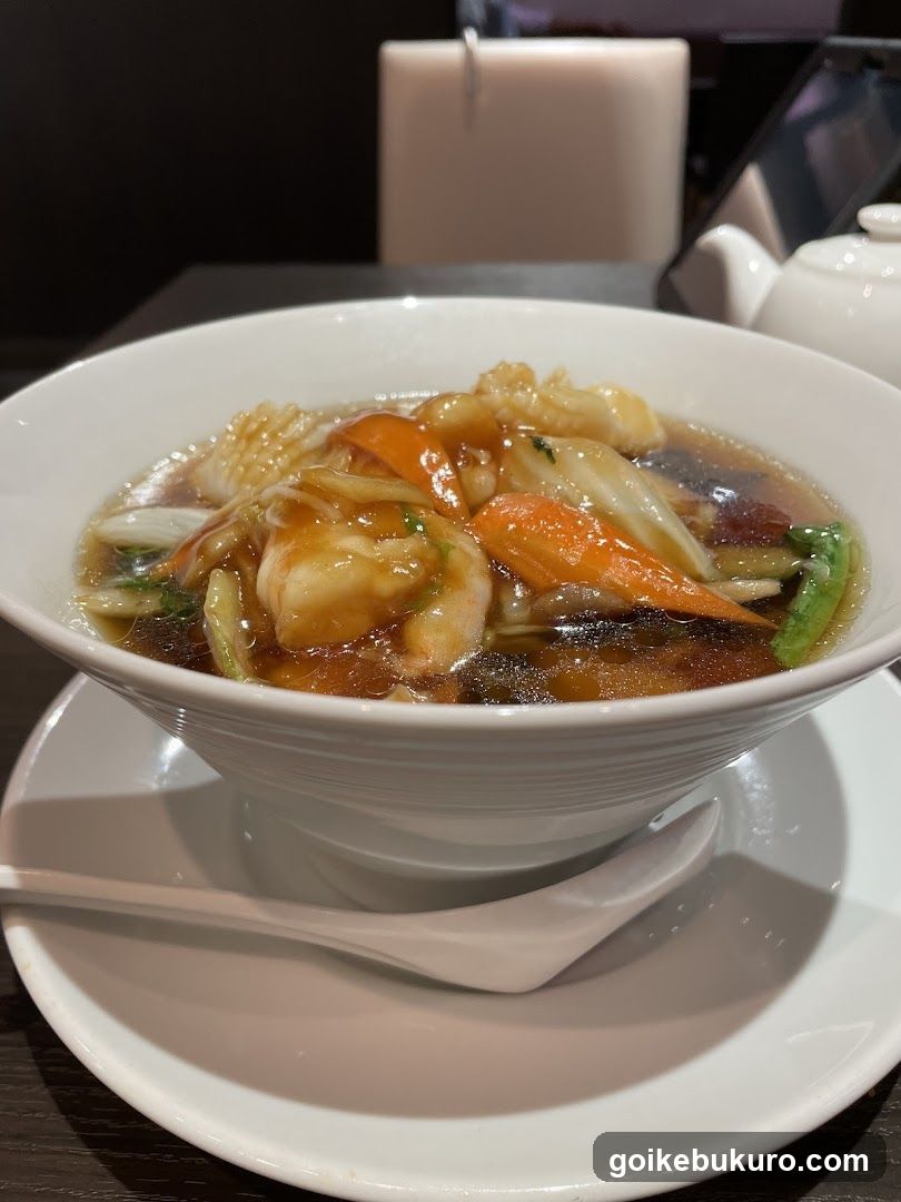 Bowl of Soup with Seafood and Vegetables