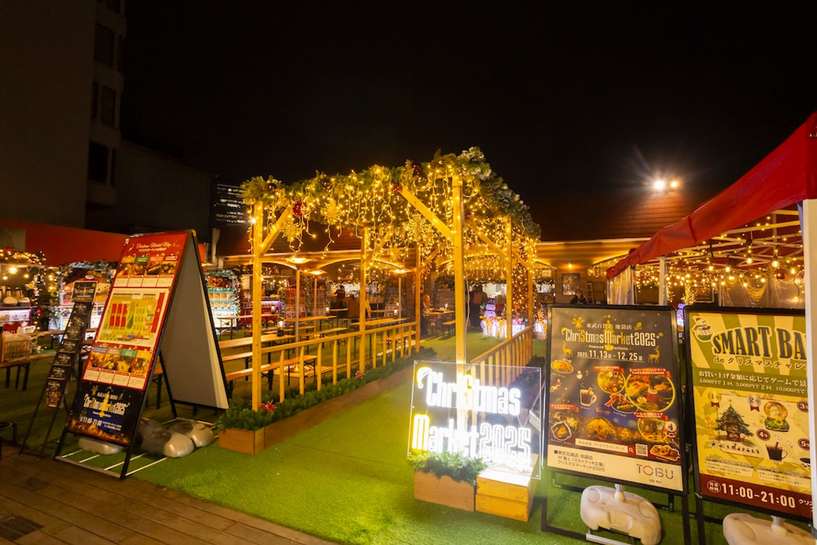 Christmas Market 2025 sign, stalls and lit wooden arch on the Sky Deck